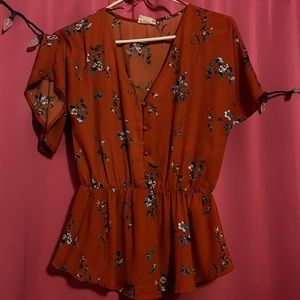 Orange shirt with floral print